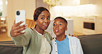 Mom, selfie and son with tongue out on sofa in home living room for bonding, memories or social media. Black family, funny face and love with woman hugging boy child for photograph or profile picture