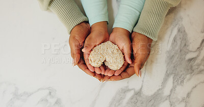 Buy stock photo Hands, parent and child with heart for sandwich, love and support with nutrition and wellness in home. Family, people and kid with bread, food and above with symbol for snack or bonding in kitchen