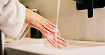 Basin, washing hands and water with woman in bathroom for hygiene, skincare or wellness. Cleaning, disinfection and wet with person at apartment sink to remove bacteria, dirt or germs for maintenance