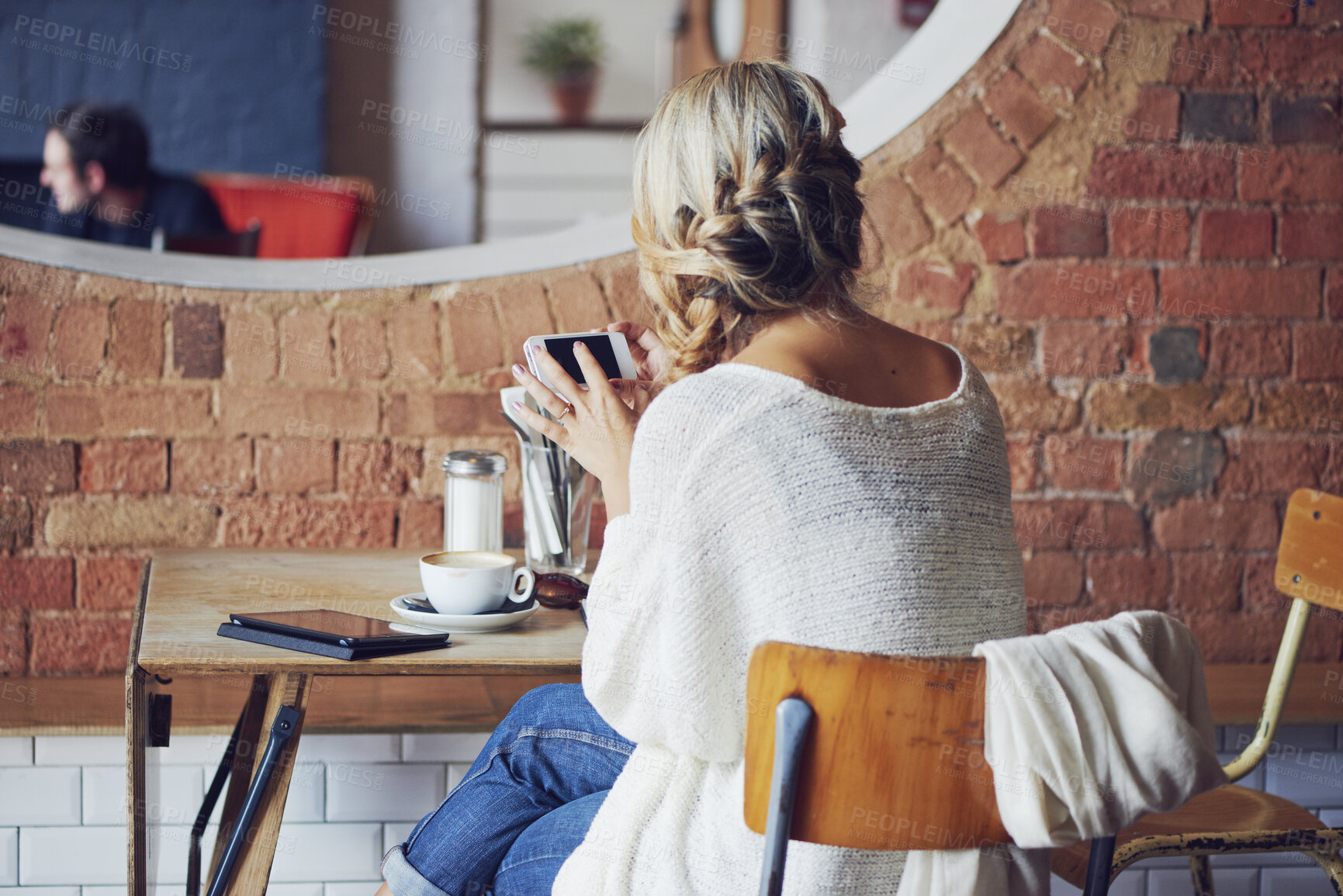 Buy stock photo Back, business and woman at cafe with phone, contact source and proofreading for publication. Freelancer, person and reading at coffee shop with mobile, editing article and notification with feedback