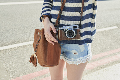 Buy stock photo Camera, hands and tourism with woman outdoor on street in city for sightseeing or travel. Holiday, photography and vacation with tourist on sidewalk to explore destination for commute or memories