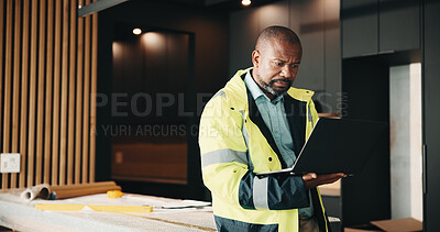Buy stock photo Architect, man and research in new home with laptop, check renovation plan and property development. Mature, black person and computer in house for architecture, review layout and remodeling design.