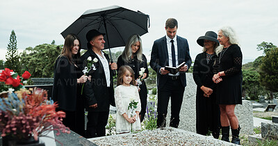 Buy stock photo Man, priest or family with holy bible in cemetery for grief, condolences or mourning at burial. Male person, speaker and empathy for farewell with book of god for faith, worship or death at graveyard