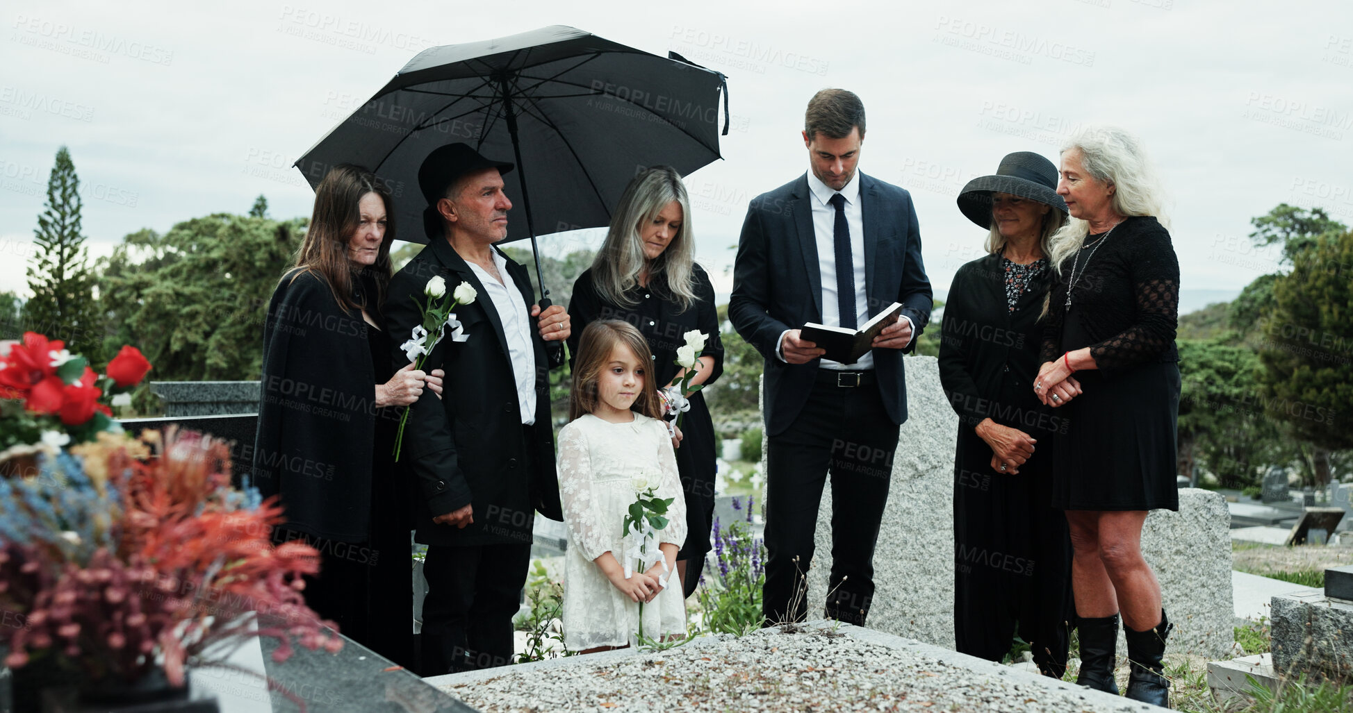 Buy stock photo Man, priest or family with holy bible in cemetery for grief, condolences or mourning at burial. Male person, speaker and empathy for farewell with book of god for faith, worship or death at graveyard