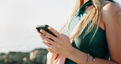 Buy stock photo Hands, typing and phone with woman at beach for travel blogger, social media and summer vacation post. Communication, online holiday guide and contact with person outdoor for tourism and chat