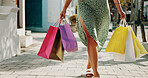 Shopping bag, gift and walking with hands of woman in city for black Friday deal, sale and discount. Savings, promotion and boutique product with person outdoor for vip customer and retail therapy