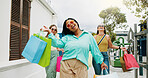 Happy women, portrait and walking with shopping bags together for discount, winning or fashion sale. Excited, female people or shopper with friends, smile or gifts for clothing, purchase or deal