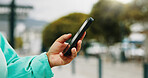 Person, hands and user with phone in city for navigation, travel app, or tourism destination. Traveler, tourist or location with network service, web or connection for outdoor trip or online tracking