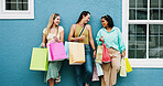 Happy women, friends and wall with shopping bags for fashion discount, sale or promotion together. Female people, shoppers or smile with group, presents or gifts for customer deal or purchase spree