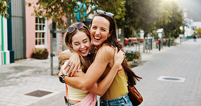 Buy stock photo Excited, hug and women in city for reunion, bonding and friends with smile for relationship or care. Outdoor, together and people with affection for solidarity, happiness and support with embrace
