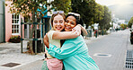 Women, hug and bonding in city for reunion, excited and friends with smile for relationship or care. Outdoor, together and interracial people with affection for support, happy and embrace on street