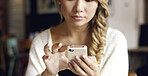 Woman, hands and typing with phone in cafe for research, network or internet connection. Female person, customer or user scrolling with mobile smartphone for social media, news or app in restaurant