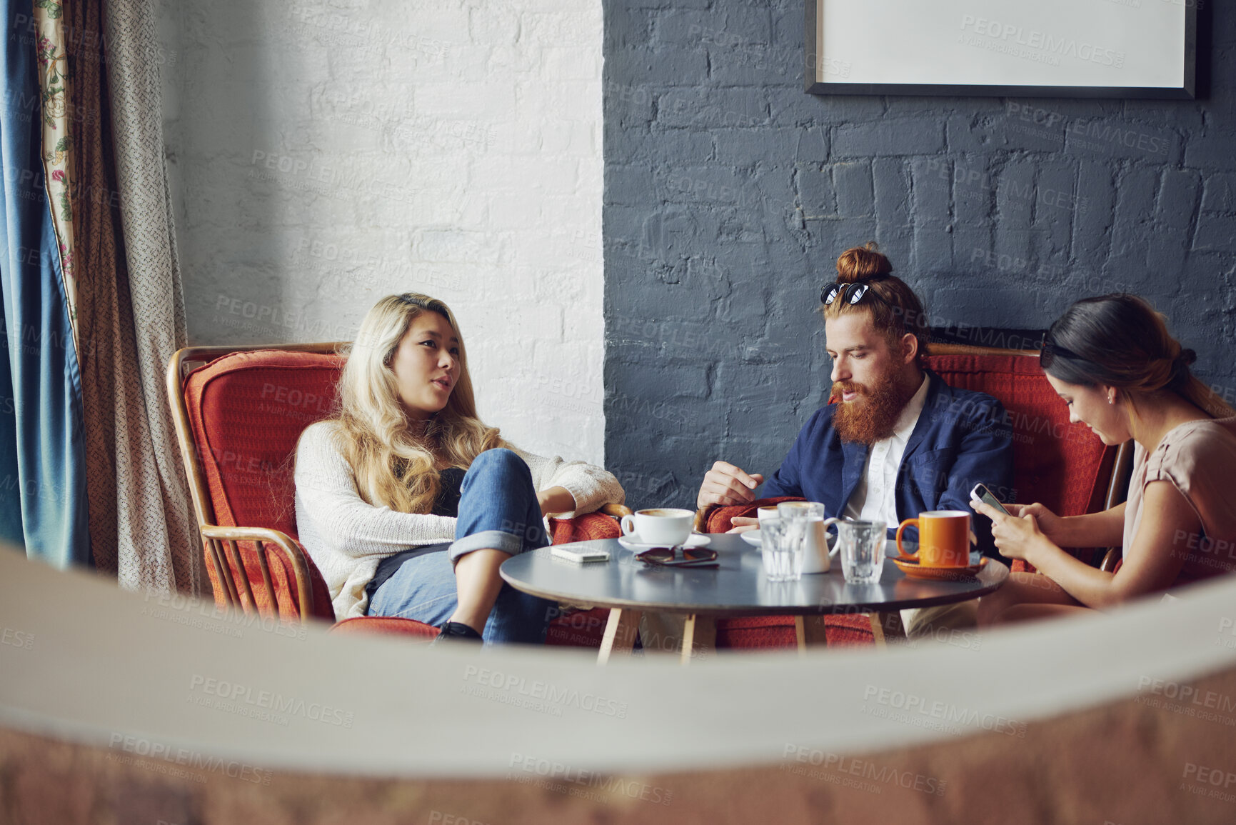 Buy stock photo Friends, relax and group with coffee in cafe, conversation and social gathering on break or bonding. Restaurant, hospitality and people with phone on weekend, customer and talking with caffeine drink
