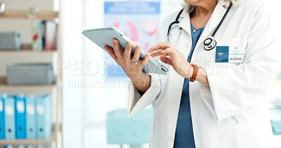 Buy stock photo Healthcare, doctor and hands with tablet in office, typing and patient records update or information. Health professional, medical research and person with tech, online and treatment plan on website