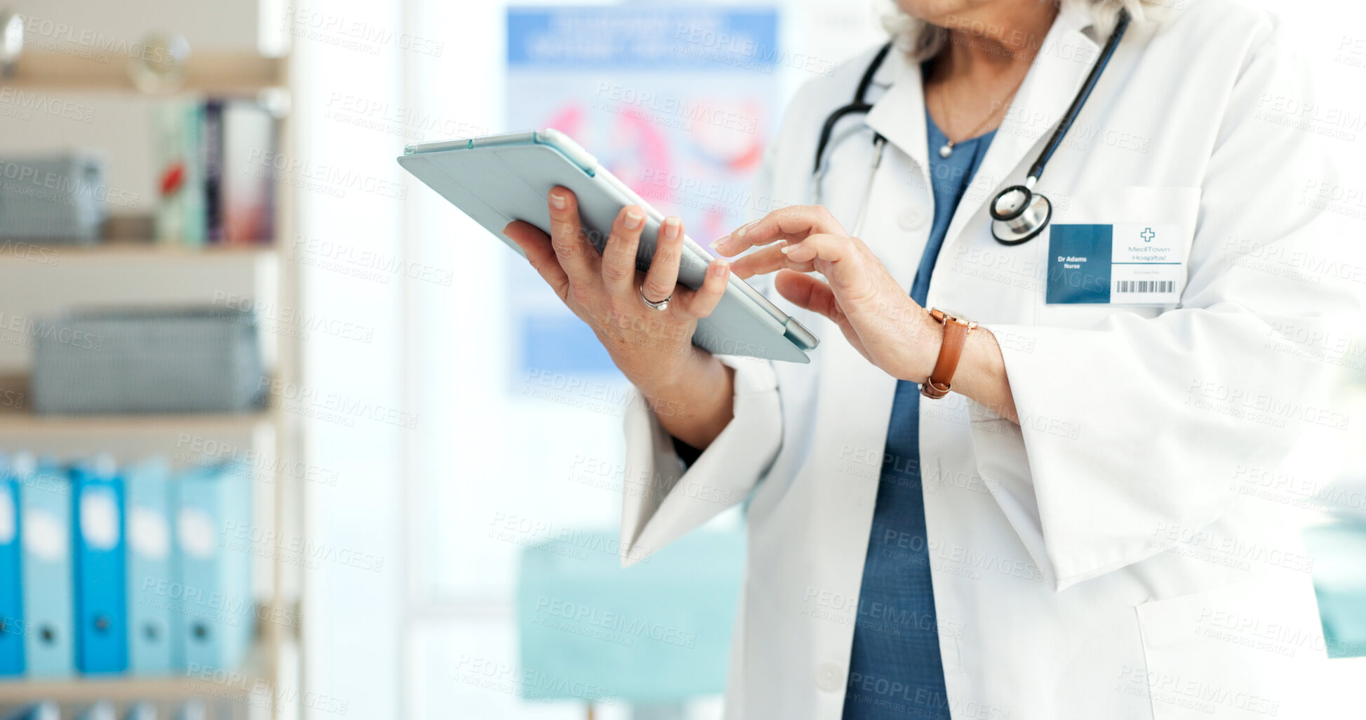 Buy stock photo Healthcare, doctor and hands with tablet in office, typing and patient records update or information. Health professional, medical research and person with tech, online and treatment plan on website