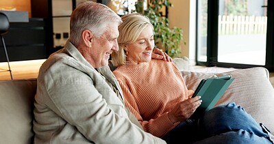 Buy stock photo Relax, home and senior couple with tablet, connection or watching movie with subscription in lounge. Mature people, embrace and streaming video with partner, smile and bonding with tech in house