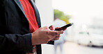 Phone, typing and hands of businessman in city for texting, networking or email for finance report. Technology, communication and male financial advisor with cellphone for feedback in urban town.