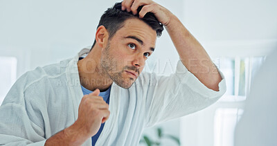 Buy stock photo Man, mirror or grooming with hair in bathroom for beauty, skincare or morning routine in home. Male person, reflection or checking hairstyle with appearance for facial cosmetics or styling in house
