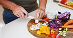 Hands, cooking and man with vegetables meal prep in kitchen for healthy salad, nutrition and lunch. Food, person and cut mushrooms in home for recipe ingredients, vegetarian dish and brunch process