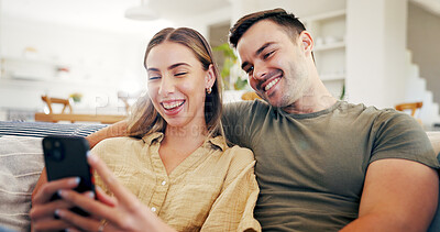 Buy stock photo Couple, laughing and relax with phone in house, bonding or streaming video with subscription on sofa. Happy people, home and watching funny comedy with partner, internet search and series on mobile