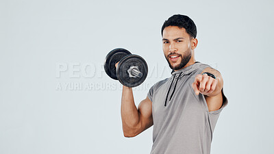 Buy stock photo Portrait, man and dumbbell in studio with point, fitness challenge and bodybuilder strength training. Mockup space, person and workout with equipment, hand gesture or bodybuilding on white background