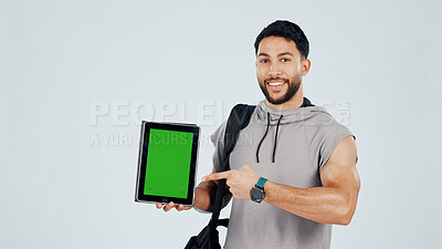 Buy stock photo Green screen, tablet and portrait of bodybuilder in studio with space for gym subscription. Happy, man and athlete pointing to digital technology for fitness app, website or blog by white background.