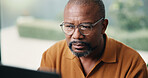 Author, reading and black man with laptop in home for online book, summary or digital manuscript. Male person, writer or glasses with computer for article publication, story writing or news in house