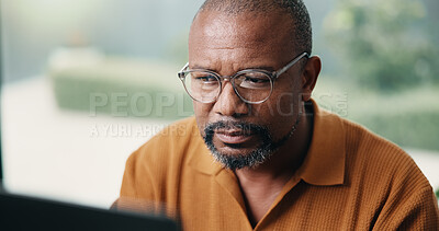 Buy stock photo Author, reading or black man with laptop in home for online book, summary or digital manuscript. Mature person, writer or glasses with computer for article publication, story writing or news in house