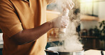 Cooking, pepper and man in kitchen with pot, recipe and meal prep for dinner, lunch or supper. Home, hands and person by stove with ingredients, seasoning and heat for nutrition, flavor and cuisine