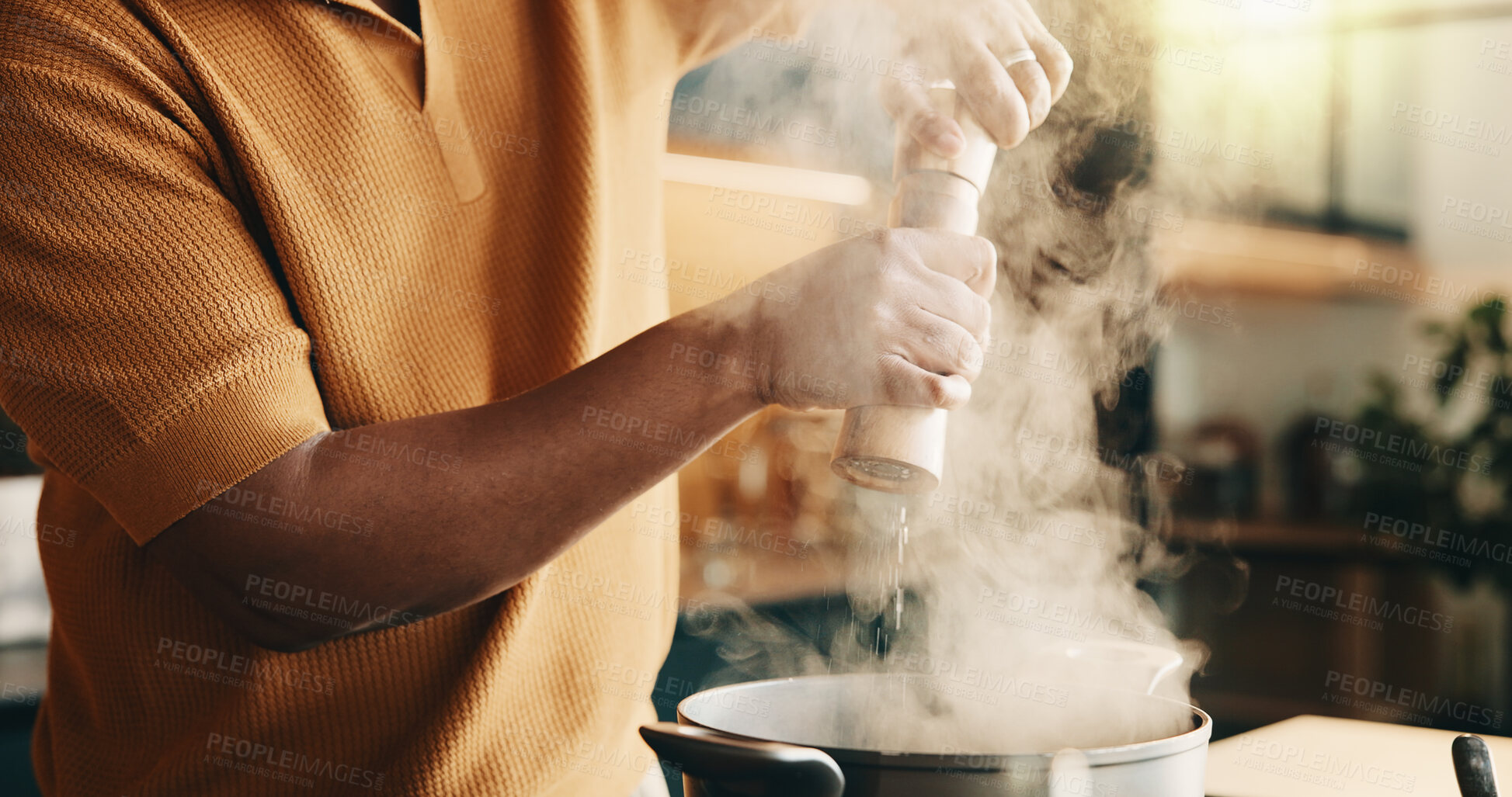 Buy stock photo Cooking, pepper and man in kitchen with pot, recipe and meal prep for dinner, lunch or supper. Home, hands and person by stove with ingredients, seasoning and heat for nutrition, flavor and cuisine