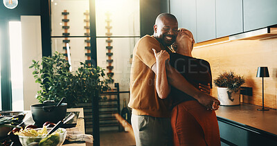 Buy stock photo Hug, dance and couple in kitchen for cooking, bonding and love with embrace, song and meal prep. Interracial, marriage and mature man and woman with music for dinner, lunch or help with food in home