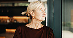 Mature, thinking or window with woman in home for reflection, nostalgia or past moment. Thoughtful, female person or memory with vision or ambition for daydreaming or contemplating choice or decision