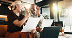 Documents, laptop and happy couple with high five in home for finance, budget or expenses together. Interracial people, smile or computer with paperwork for financial success or investment in house