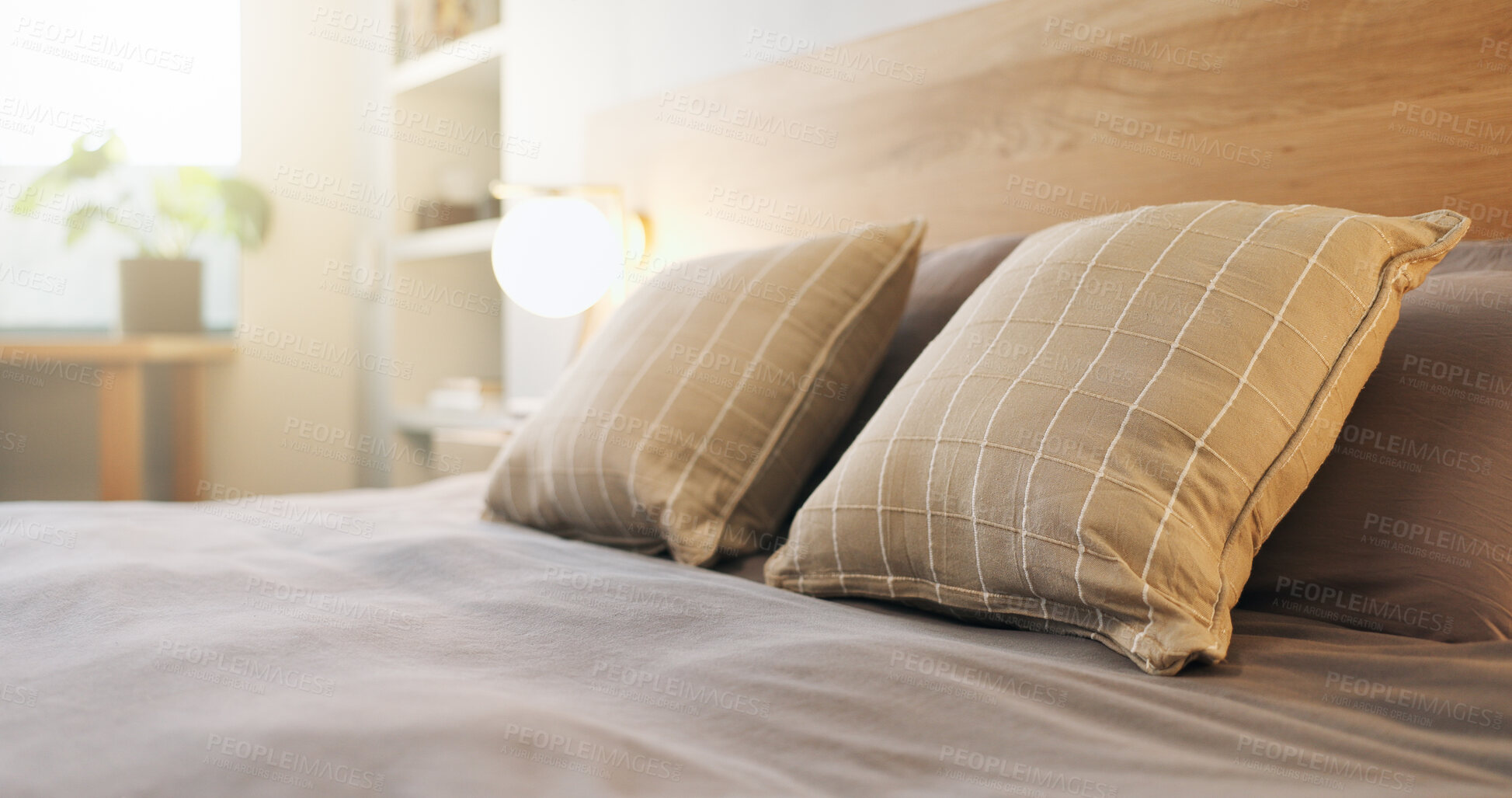 Buy stock photo Hotel, empty and bed in room for accommodation, furniture and interior design for luxury resort. Hospitality, space and bedroom with pillows, duvet and bedding for comfort, housekeeping and clean