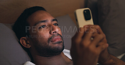 Buy stock photo Night, online and man with phone in bed for social media, chat and browse internet for insomnia. Home, bedroom and tired person on cellphone for connection, website and notification for communication