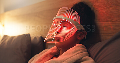 Buy stock photo Red light, mask and woman in bedroom with skincare for beauty, wellness and collagen production. Health, relax and person in bed with LED phototherapy for dermatology or facial treatment in home