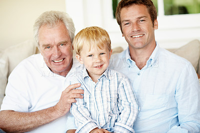 Buy stock photo Portrait, dad and grandpa with child in lounge, happy and connection with grandchild or love in home. Family, generations and people with smile for kid, bonding and fathers day celebration in house