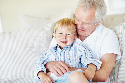 Buy stock photo Hug, laugh and grandfather with child on sofa for bonding, relationship and visit on weekend. Family, portrait and senior man with boy on couch for connection, relax and affection in home together