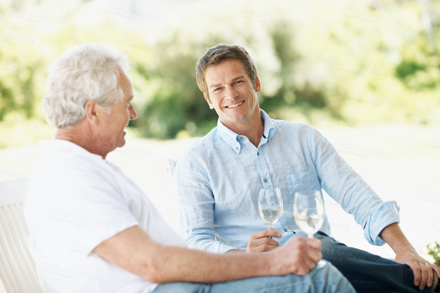 Buy stock photo Happy, wine and man with senior parent for bonding, conversation and relax on weekend. Family, portrait and person with elderly father, alcohol and drinks for connection, relationship and talking