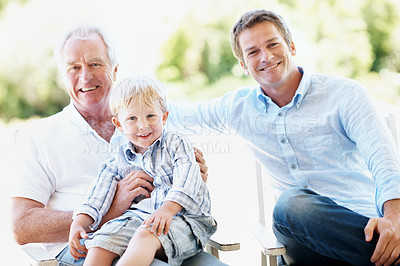 Buy stock photo Grandpa, dad and child in backyard for portrait, bonding and relax together on weekend. Generations, family and boy with senior man, father and happy for relationship, connection and reunion outdoor