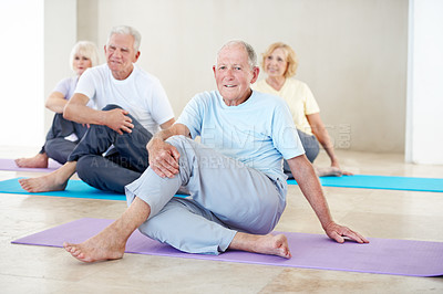 Buy stock photo Yoga, old man and smile with stretching in class for flexibility, mobility exercise and health. Group, senior person or lord of the fishes pose in studio for fitness, retirement wellness and portrait