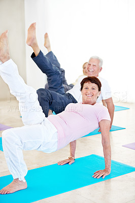 Buy stock photo Stretching, portrait and senior woman in yoga class for wellness, happy and balance in retirement. Elderly resident, smile and bridge pose in health club for core exercise, fitness and cardio