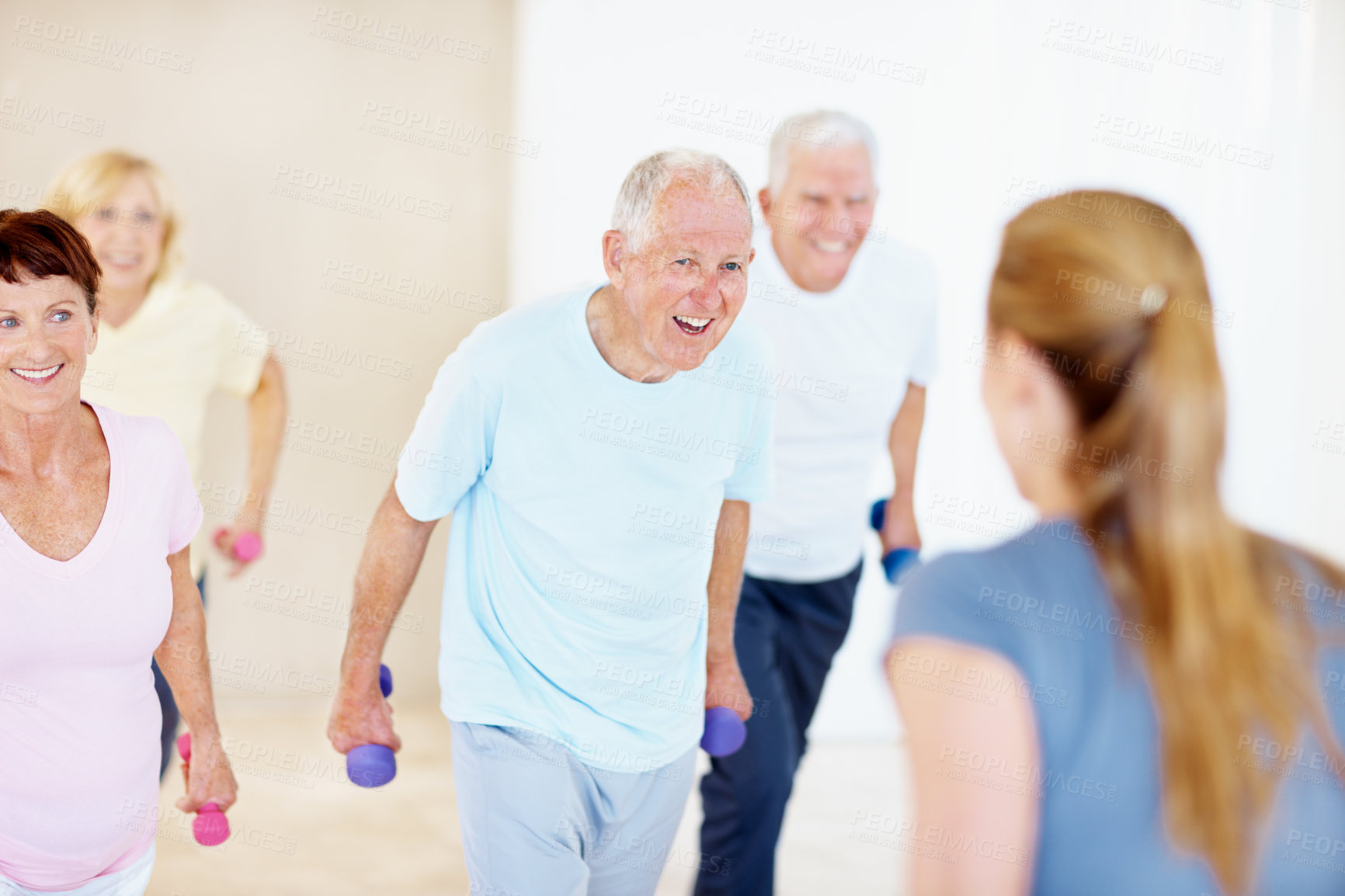 Buy stock photo Weights, personal trainer and senior people in class for exercise, wellness and active hobby. Retirement, gym and elderly men and women with dumbbells for health, muscle strength and workout together