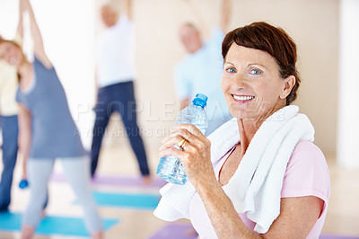 Buy stock photo Portrait, rest or old woman in gym class with drink, cardio break or group fitness in workout hobby. Happy, towel or elderly person with water, cool down or hydration recovery in retirement training.