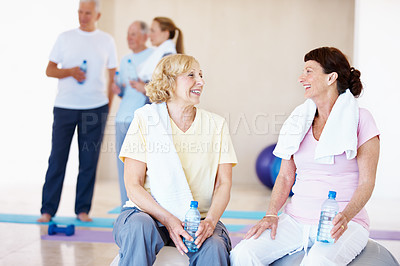 Buy stock photo Fitness, happy or old women in class with break, cardio rest or bonding in workout hobby. Smile, cool down or friends in center with water bottle, team connection or recovery in retirement training.