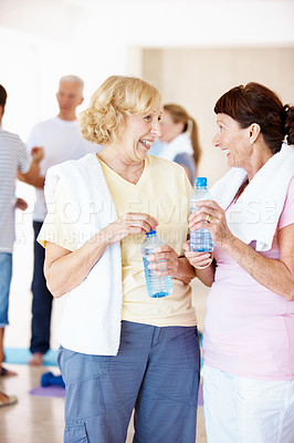 Buy stock photo Fitness, break or old women in center with waterbottle, cardio rest or bonding in workout hobby. Happy, cool down or friends with hydration drink, team connection or recovery in retirement training.