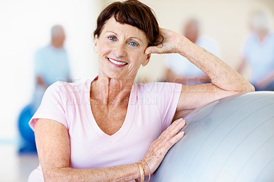 Buy stock photo Old woman, portrait and exercise ball in gym for pilates, preparation and wellness. Elderly person, smile and group in health club with confidence, mobility workout and fitness for retirement