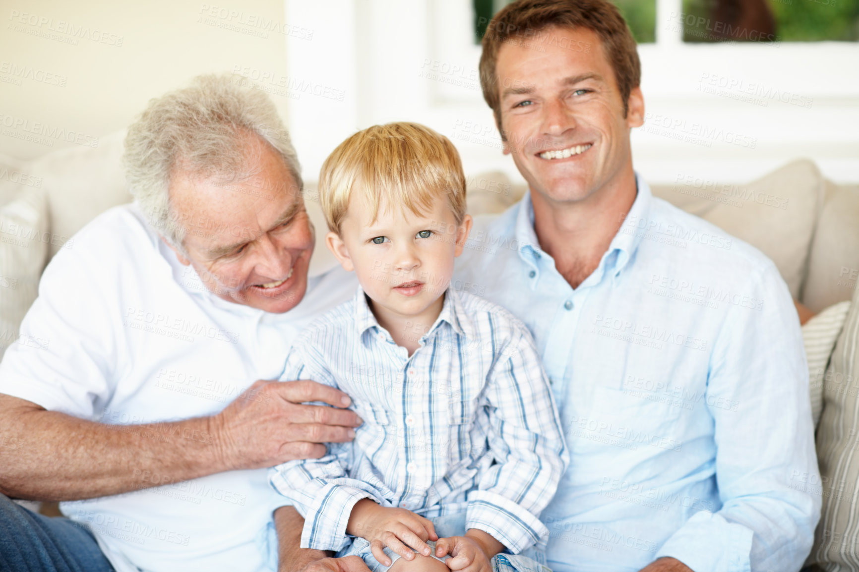 Buy stock photo Happy, dad and grandpa with child in lounge, bonding and connection with grandchild on couch in home. Family, generations and people with smile for kid, portrait and fathers day celebration in house