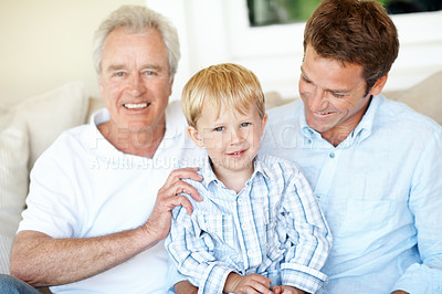 Buy stock photo Old man, support and dad with child in lounge, smile and connection with grandchild on couch in home. Family, generations and happy people with kid, portrait and fathers day celebration in house