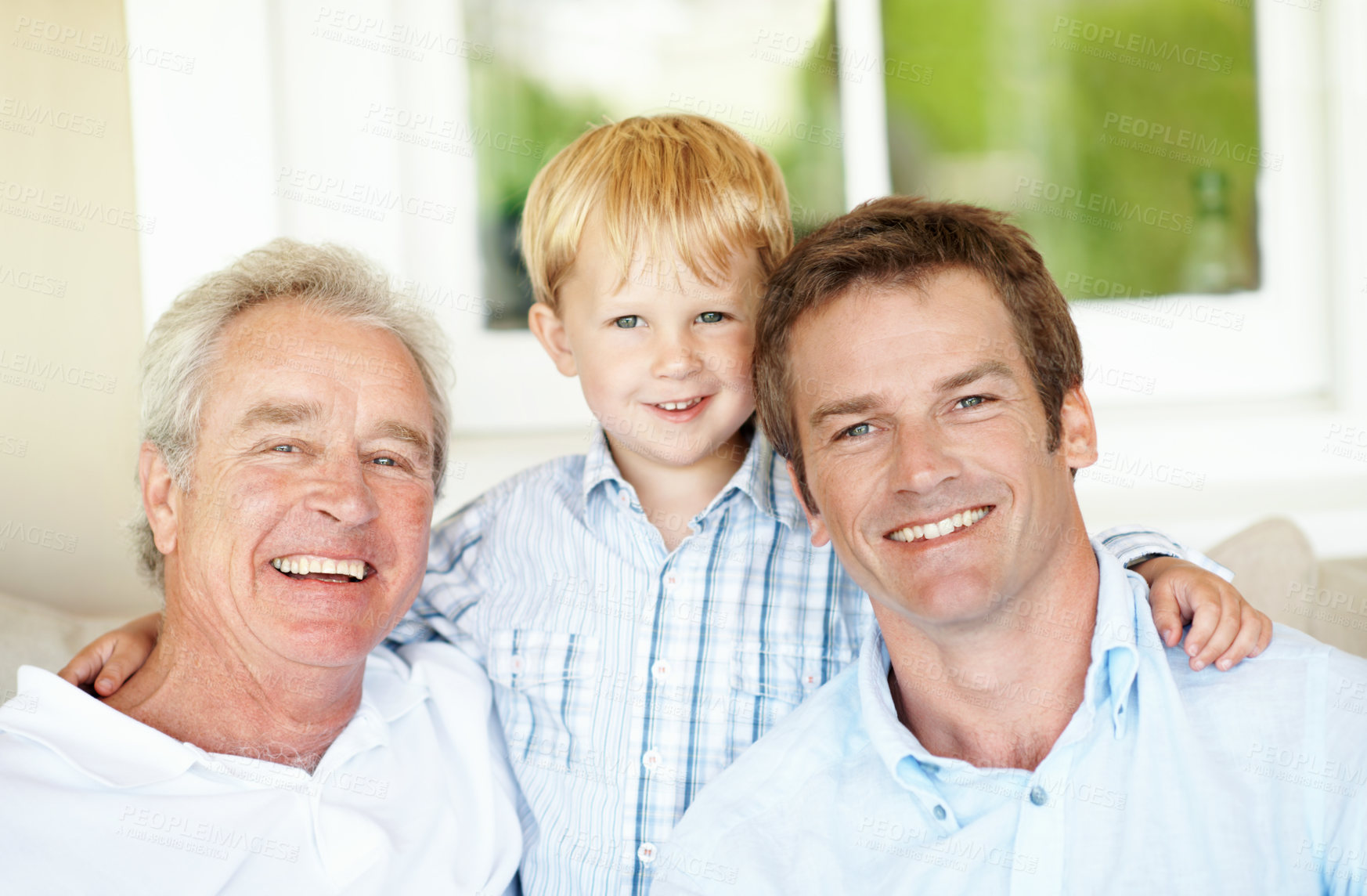 Buy stock photo Family, relax and child in home with smile, love and bonding together with affection. Portrait, father or grandfather embrace in living room with kid, connection and generations relationship at house
